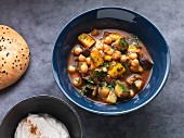 Oriental stew with Mediterranean vegetables and chickpeas with unleavened bread