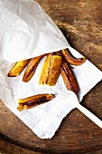 Grilled plantains in a paper bag