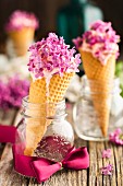 Vanilla ice cream with lilac flowers in cones
