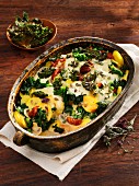 Potato and kale gratin with sunflower seeds and mushrooms