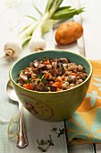 Grain soup with mushrooms, carrots, onions and potatoes