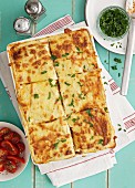 Lasagne with parsley and tomato salad
