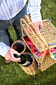 A picnic basket with wine