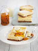 Slices of cheesecake with passion fruit sauce