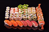A sushi platter with nori maki, California maki and nigiri