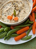 Artichoke- hummus with spinach served with peas in pods and carrots