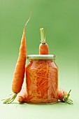 Fresh carrots and a glass of carrot salad