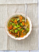Minestrone with cabbage, tomatoes, carrots and broad beans