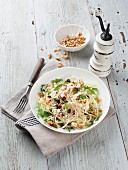 Kohlrabi and apple salad with goat's cheese, walnuts and cranberries