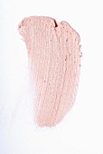 Light-pink lipstick on a white surface