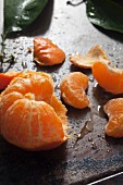 A peeled clementine peel and leaves