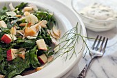 Spinach salad with apples, fennel, smoked trout and a yoghurt dressing