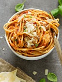 Pasta al pomodoro (pasta with tomato sauce, Italy) with grated Parmesan