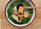 Udon noodle soup with salmon and spinach