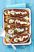 Baked aubergines stuffed with minced meat, pine nuts and yoghurt