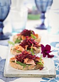 Crostini topped with salmon and beetroot salad