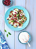 Grilled courgette with yoghurt, sambal oelek and pomegranate