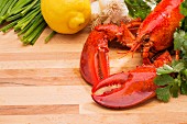 Steamed lobster with lemons and fresh vegetables