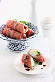 Stuffed roast beef rolls with sesame seeds (Asia)