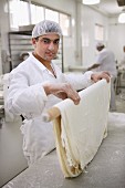 Unleavened bread being made in a bakery in Lebanon