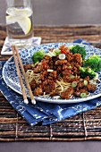 Minced meat with oriental noodles and broccoli