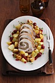 Roast turkey roulade with potatoes, redcurrants and gooseberries