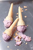 Blueberry ice cream with flaked almonds in cones