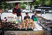A fast food stand with grilled fish (Asia)