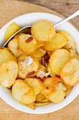 Fried potatoes with diced bacon