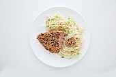 Fried tuna fish fillet with sesame seeds, black caraway seeds and glass noodles