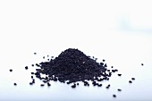 A pile of black caraway seeds