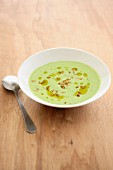Cold yoghurt and herb soup with olive oil and nuts