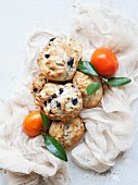 Blueberry scones with mandarins on a muslin cloth