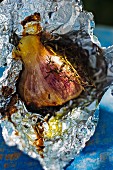 Roasted garlic in aluminium foil