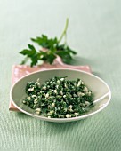 Coarse salt with parsley on a small plate