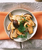 Fried, sliced porcini mushrooms with parsley