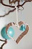 Heart-shaped Christmas-tree decoration made from old book pages