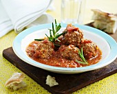 Lamb meatballs in tomato sauce with rosemary