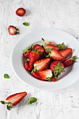 Strawberries on a white plate.