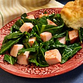 Kale with diced, smoked ham and American biscuit