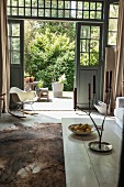 Dining area in converted stables with open wooden doors