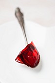 Red jelly on a spoon