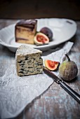 Fourme D'Ambert (French blue cheese) and wine hard cheese from Italy with figs
