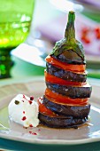 An aubergine and tomato tower with goat's cream cheese