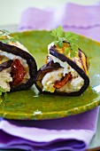 Aubergine rolls with goat's cream cheese, dried tomatoes and olive oil