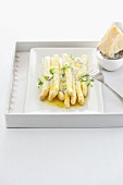 Asparagus with a lemon and honey sauce and Parmesan cheese