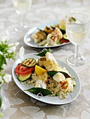 Fish skewers on couscous