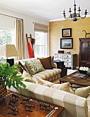 Striped sofas in Colonial-style living room in shades of brown