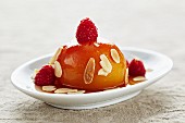 Honey peaches with almonds and raspberries