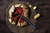 Tomato tart with cheese and rosemary, sliced (seen from above)